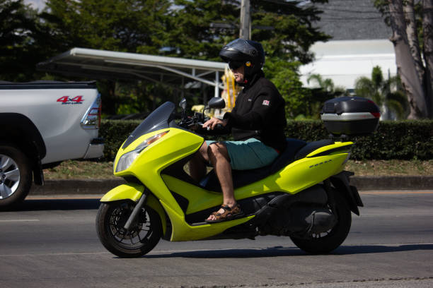 Chiangmai, Thailand - November 21 2019: Private Honda Forza  Motorcycle. On road no.1001, 8 km from Chiangmai city.