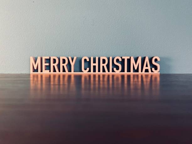 istock MERRY CHRISTMAS phrase on blue background 1191624202
