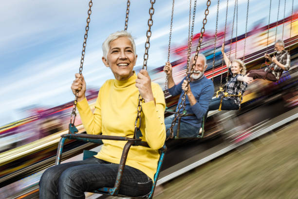 istock Chain swing ride at amusement park in blurred motion! 1191625511