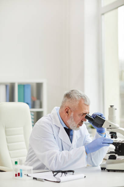 istock Mature doctor working in laboratory 1191626063