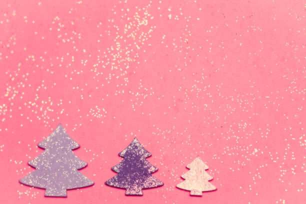istock Christmas decoration, trees on pink background 1191626111