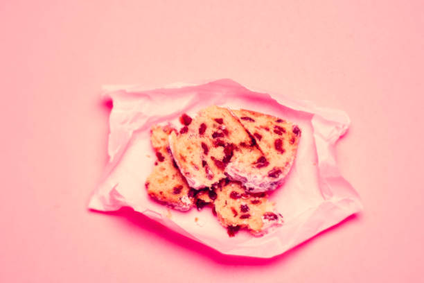 istock Broken Slice of Stollen,  traditional Christmas Cake, pink light 1191626212