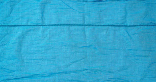 istock fragment of blue cotton fabric with a seam, full frame 1191628305