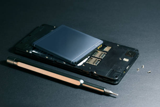 istock Repair smartphone, disassembled phone with a screwdriver 1191630220