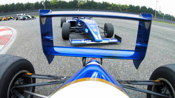 istock Racing cars driving on track 1191633100