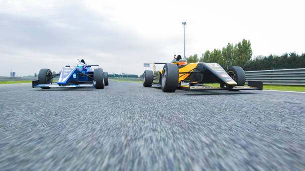 istock Drivers driving racing cars 1191633103