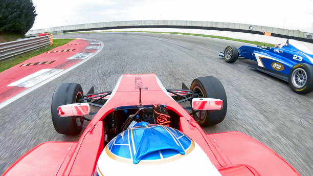 istock Racing cars driving on track 1191633104