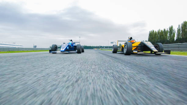 istock Drivers driving racing cars 1191633107