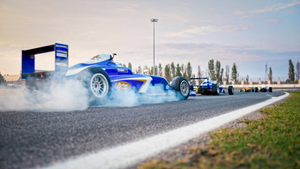 istock Racing cars driving on track 1191633617