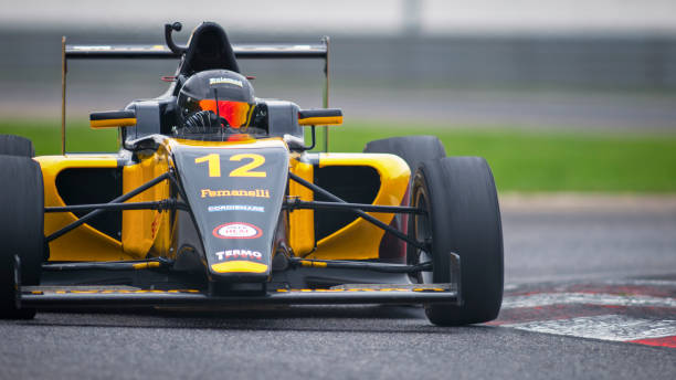 istock Man driving racing car 1191633623