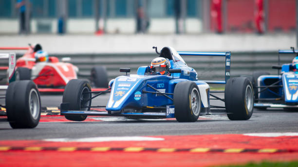 istock Man driving racing car 1191633626