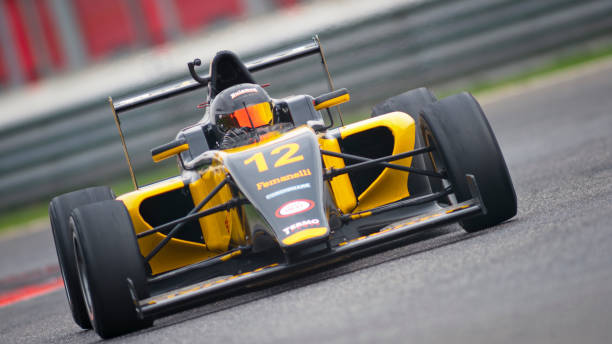 istock Man driving racing car 1191633628