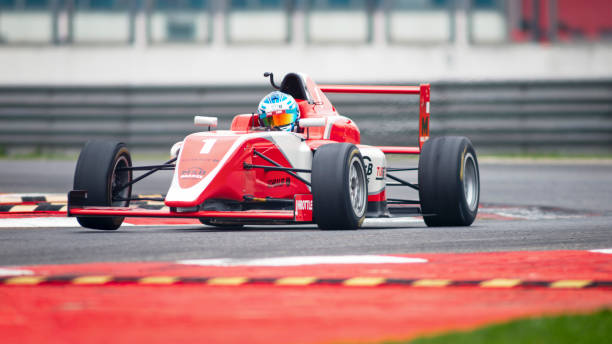 istock Man driving racing car 1191633629