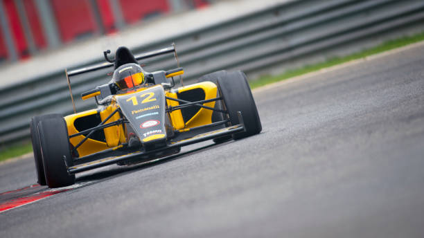 istock Man driving racing car 1191633630