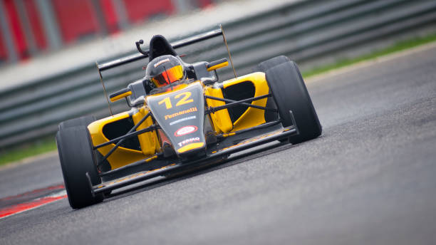 istock Man driving racing car 1191633631