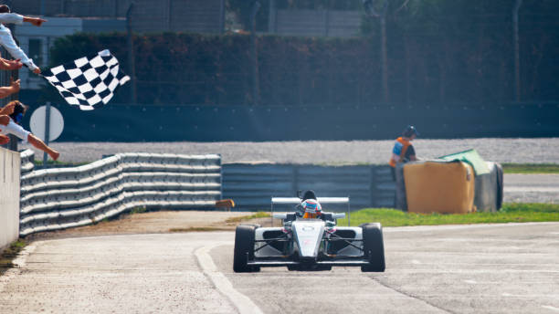 istock Man driving racing car 1191633632