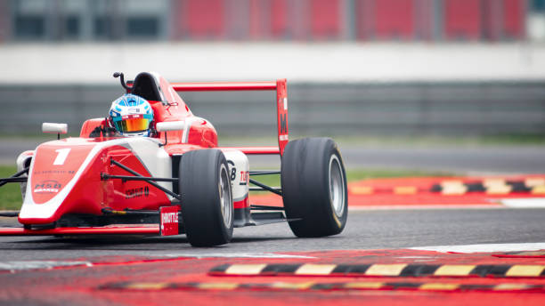istock Man driving racing car 1191633635
