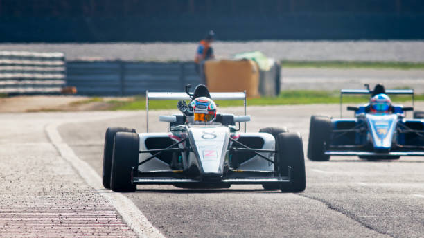 istock Man driving racing car 1191633637