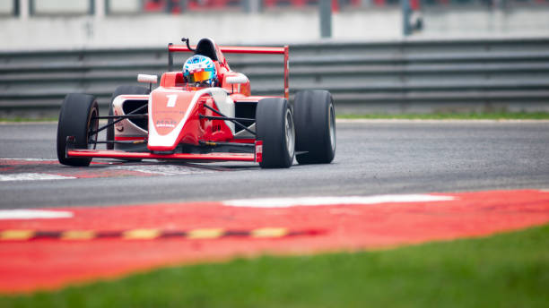 istock Man driving racing car 1191633638