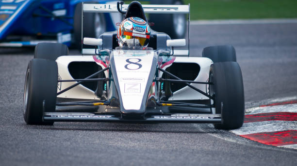 istock Man driving racing car 1191633641