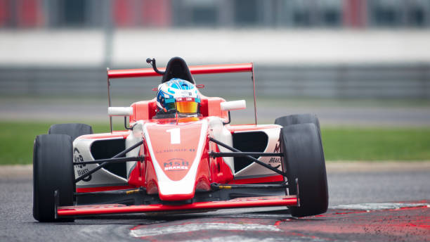istock Man driving racing car 1191633644