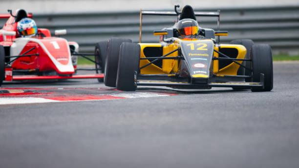 istock Man driving racing car 1191633648