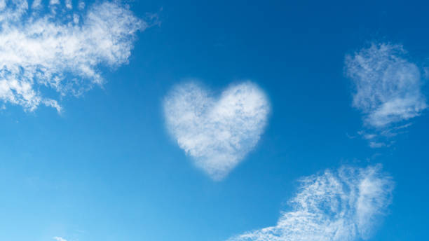 istock Heart shaped cloud against blue sky 1191634699