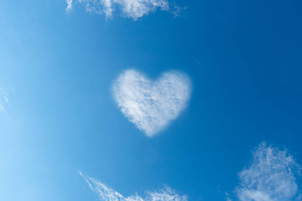 istock Heart shaped cloud against blue sky 1191634719