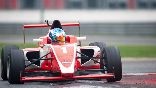 istock Man driving racing car 1191635183