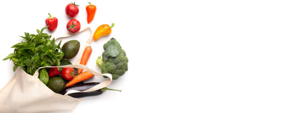 Fresh variety of vegetables in zero waste cotton bag