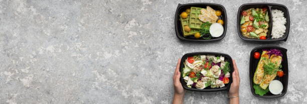 istock Woman taking plastic container with delicious healthy meal 1191635967