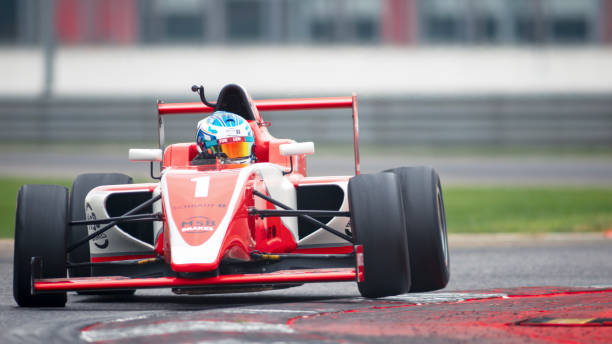 istock Man driving racing car 1191636006