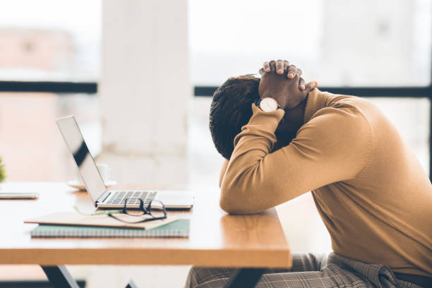 Exhausted african american manager feeling sad and desperate Problems At Work. Black businessman feeling upset and desperate, working at office, hands on head. Free space mental burnout photos stock pictures, royalty-free photos & images