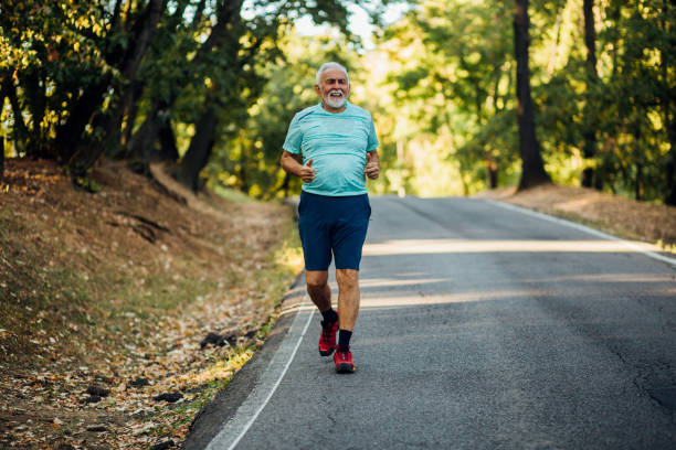 istock Mature man running on the road 1191637476