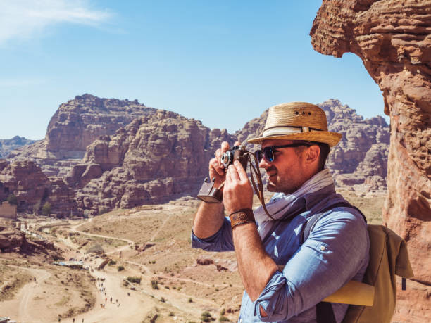 istock Tourist with a vintage camera. Petra, Jordan. 1191637674