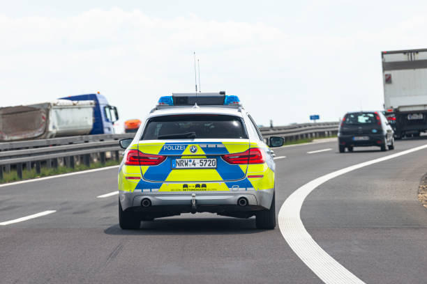 Bonn, Germany May 23, 2019. German police car BMW driving on the highway, rear view. stock photo