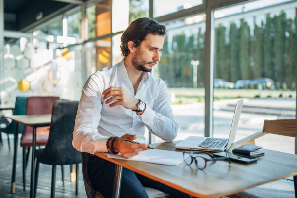 istock Businessman sitting in cafe 1191638106
