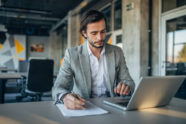 istock Modern businessman working in office 1191638226