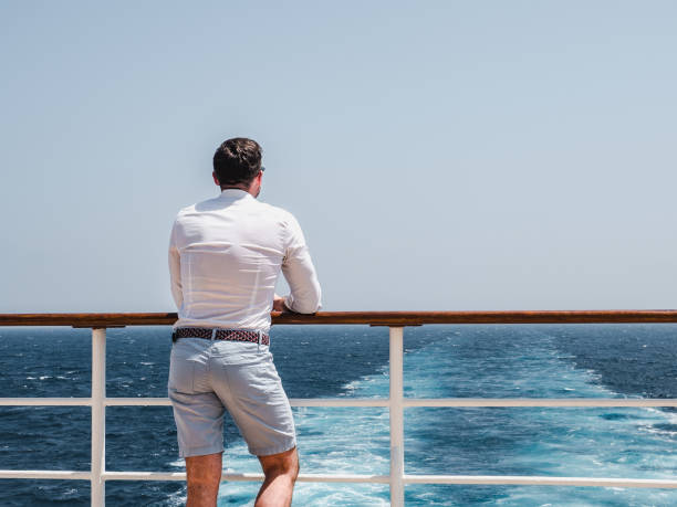istock Man on the empty deck of a cruise liner 1191638413