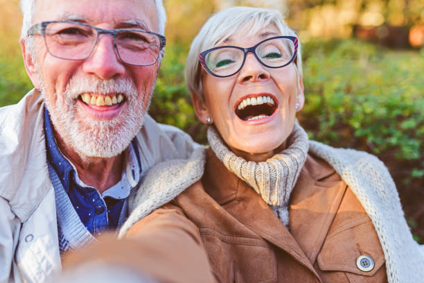 istock Cheerful seniors using modern technology. Taking selfie photos. 1191640219