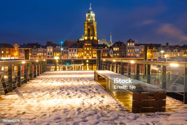 Skyline Of Deventer At The River Ijssel During A Cold Winter Evening Stock Photo - Download Image Now
