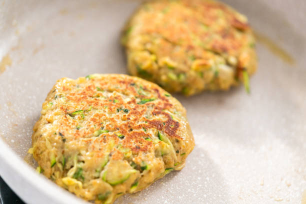 istock Frying zucchini cakes in olive oil 1191640965