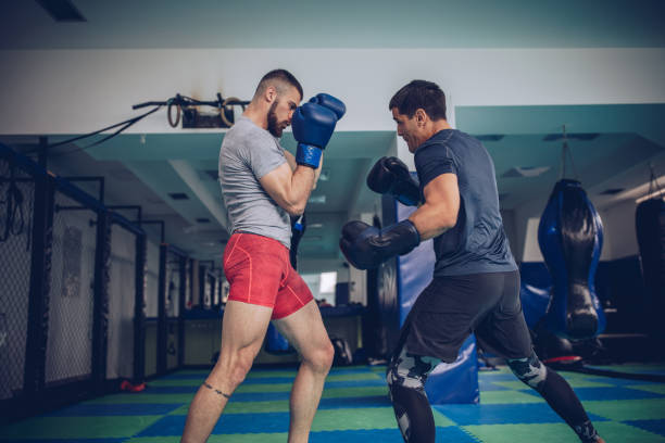istock Two boxers sparing in gym 1191641453