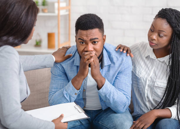 istock Caring black wife and counselor supporting man during psychotherapy session 1191645445