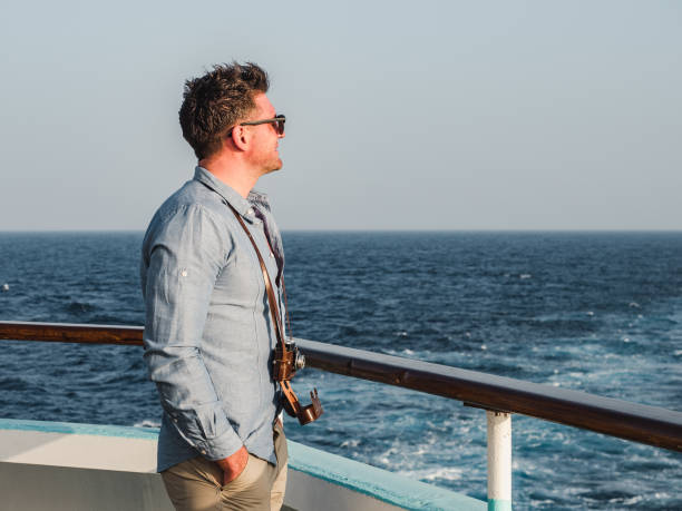 istock Man on the empty deck of a cruise liner 1191645536