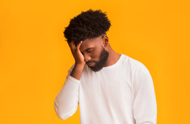 istock Upset black guy covering his face with hand 1191645542