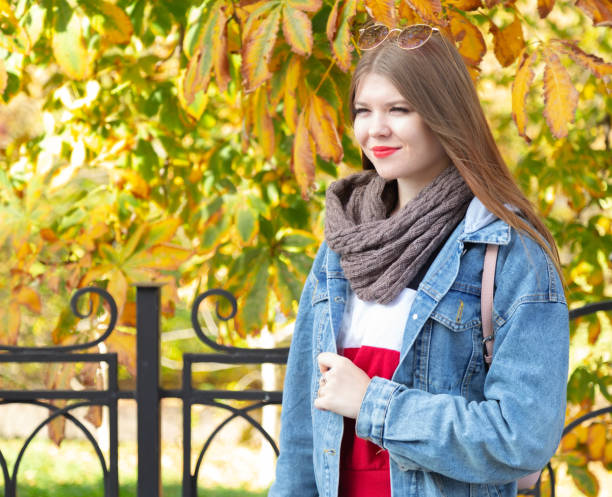 istock A young woman walks in the park. 1191647277