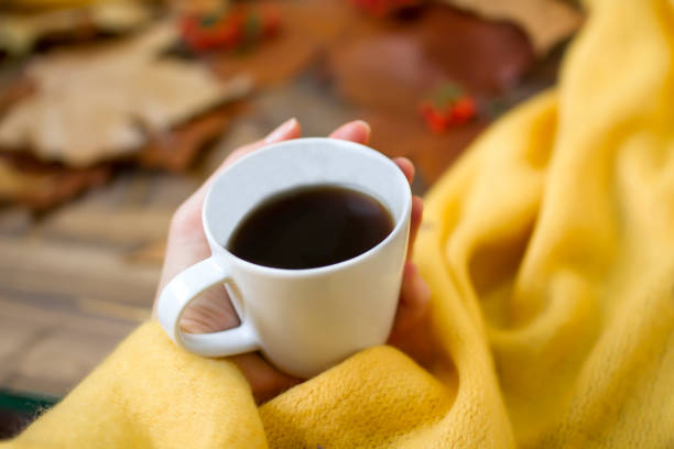 istock Woman's hand holding a cup of coffee 1191648313