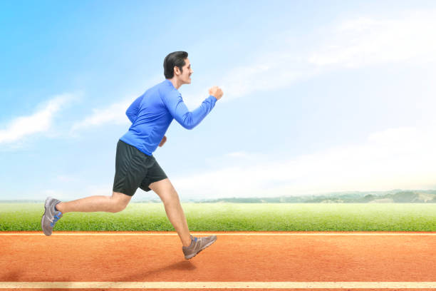 istock Asian runner man running on the running track 1191648512