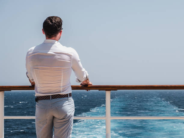 istock Man on the empty deck of a cruise liner 1191648593